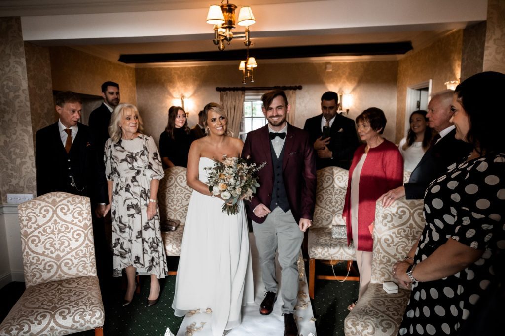 Bride being walked down the aisle at their micro wedding at The Cavendish Hotel