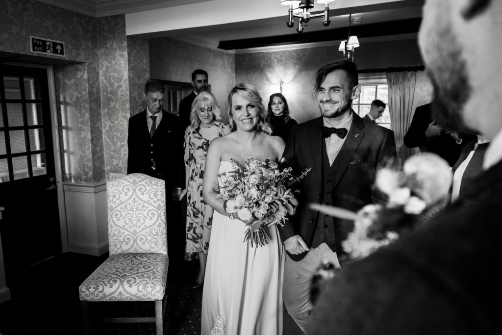 Bride being walked down the aisle at their micro wedding at The Cavendish Hotel
