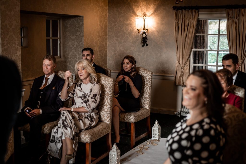 Wedding guests during their wedding ceremony at their micro wedding at The Cavendish Hotel