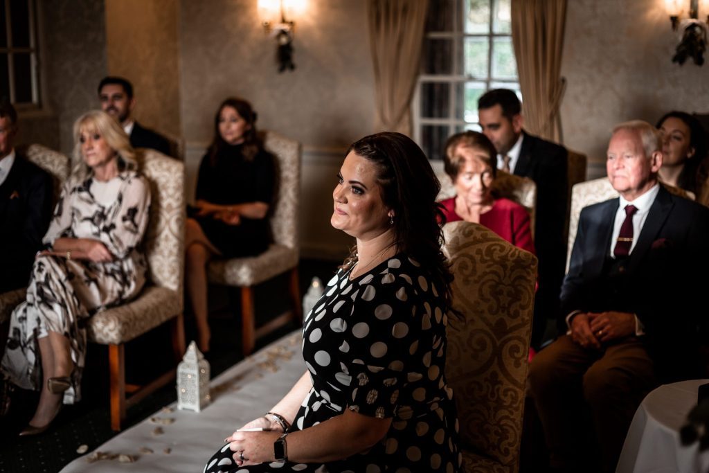 Wedding guests during their wedding ceremony at their micro wedding at The Cavendish Hotel
