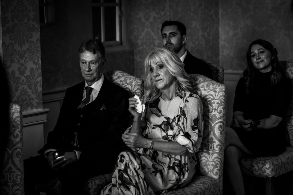 Wedding guests during their wedding ceremony at their micro wedding at The Cavendish Hotel