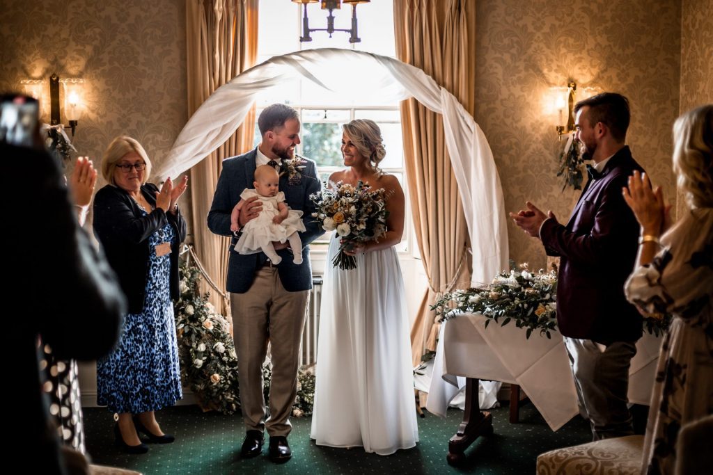 Newly married Bride & Groom at the end of their wedding ceremony at their micro wedding at The Cavendish Hotel