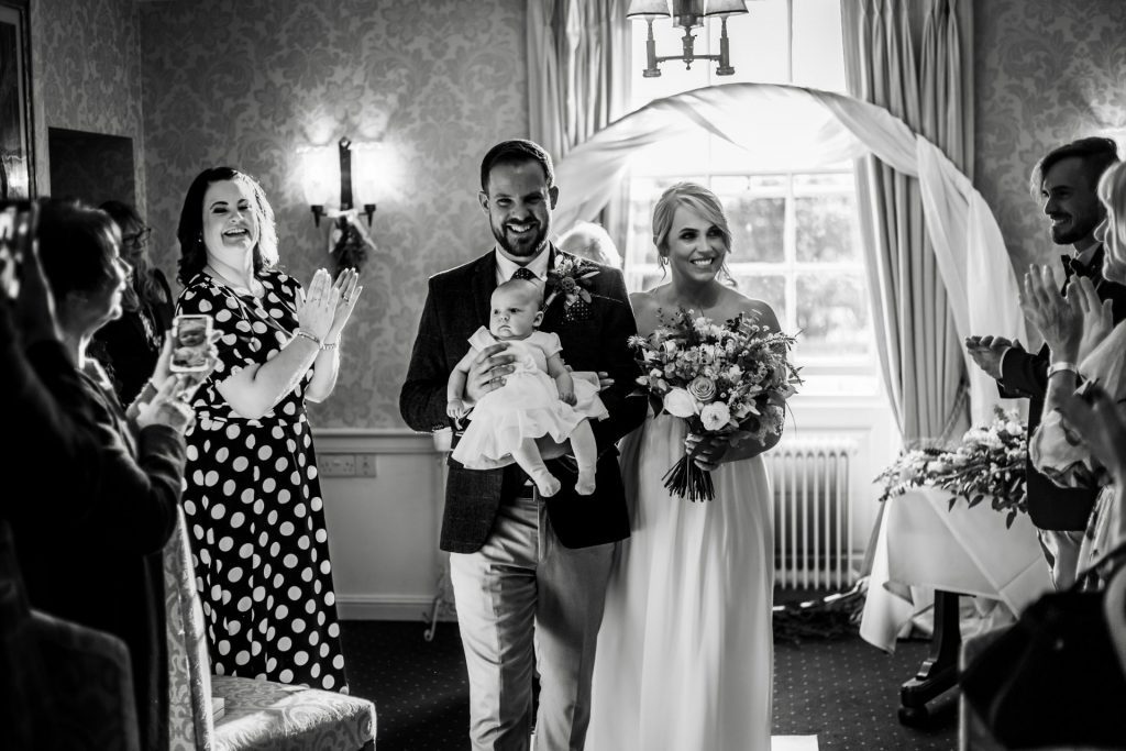 Newly married Bride & Groom at the end of their wedding ceremony at their micro wedding at The Cavendish Hotel