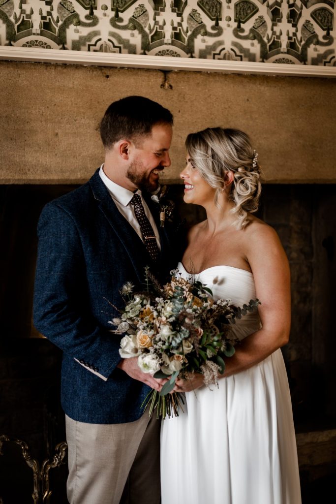 Bride & Groom pose inside their venue after the wedding ceremony at their micro wedding at The Cavendish Hotel