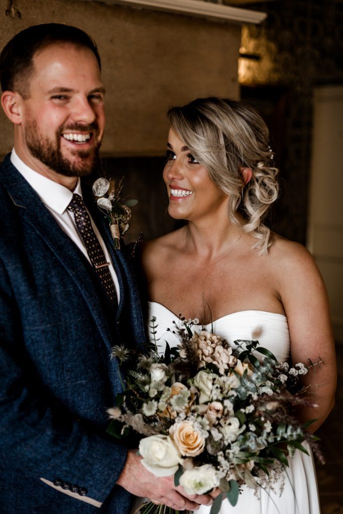 Bride & Groom pose inside their venue after the wedding ceremony at their micro wedding at The Cavendish Hotel