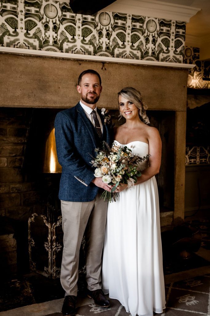 Bride & Groom pose inside their venue after the wedding ceremony at their micro wedding at The Cavendish Hotel