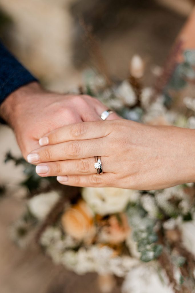 Bride & Groom show their wedding rings at their micro wedding at The Cavendish Hotel