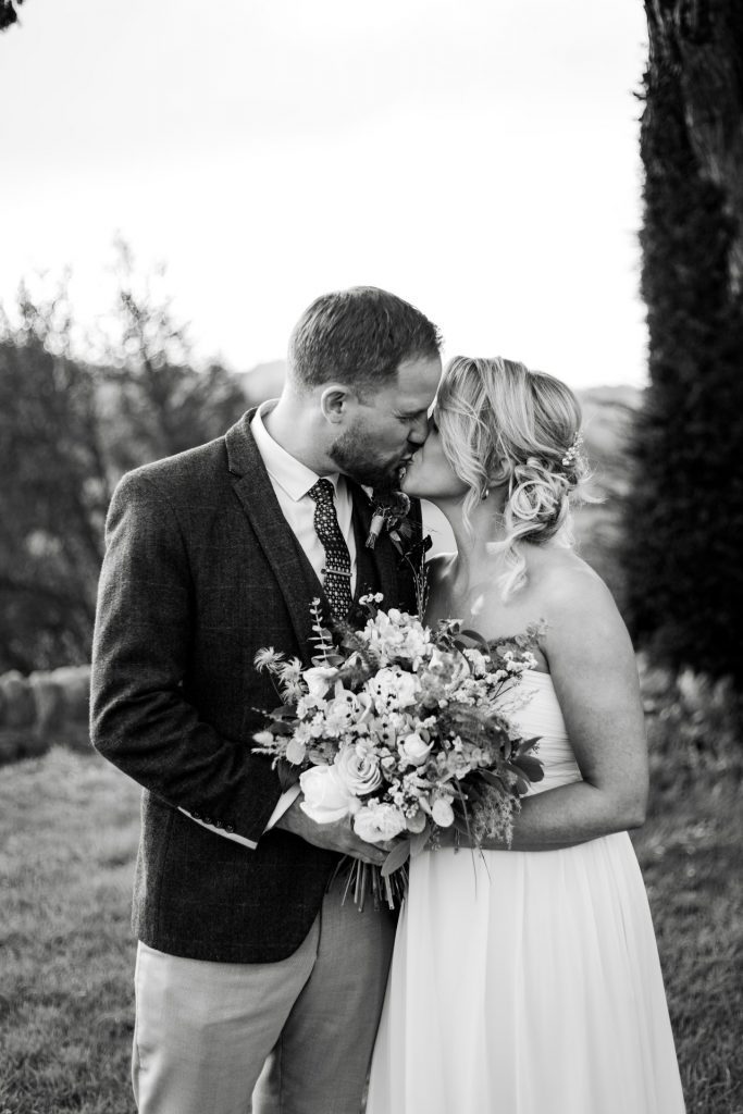 Bride & Groom pose outside of their venue after the wedding ceremony at their micro wedding at The Cavendish Hotel