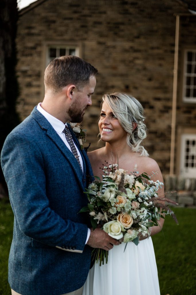 Bride & Groom pose outside of their venue after the wedding ceremony at their micro wedding at The Cavendish Hotel