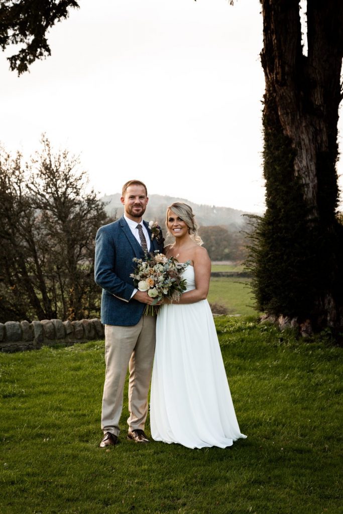 Bride & Groom pose outside of their venue after the wedding ceremony at their micro wedding at The Cavendish Hotel