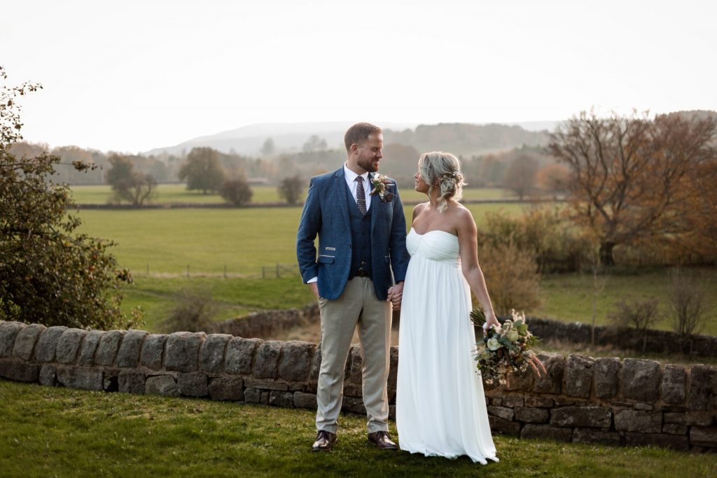 Bride & Groom pose outside of their venue after the wedding ceremony at their micro wedding at The Cavendish Hotel