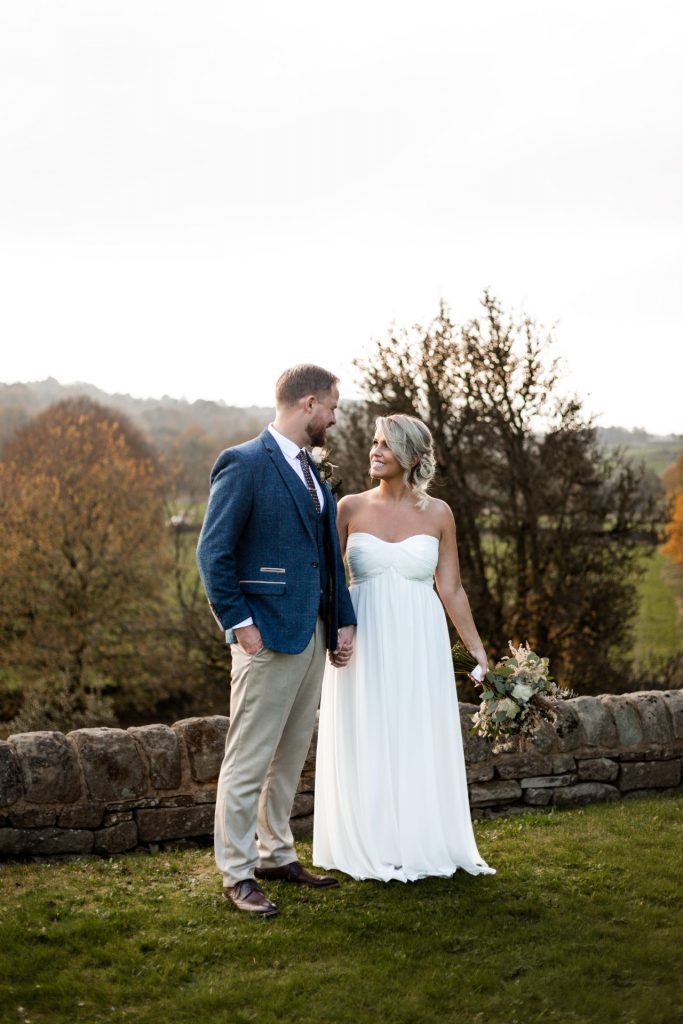 Bride & Groom pose outside of their venue after the wedding ceremony at their micro wedding at The Cavendish Hotel