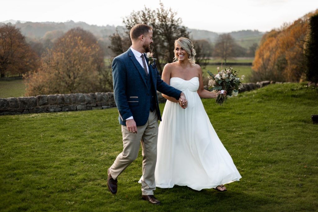 Bride & Groom pose outside of their venue after the wedding ceremony at their micro wedding at The Cavendish Hotel