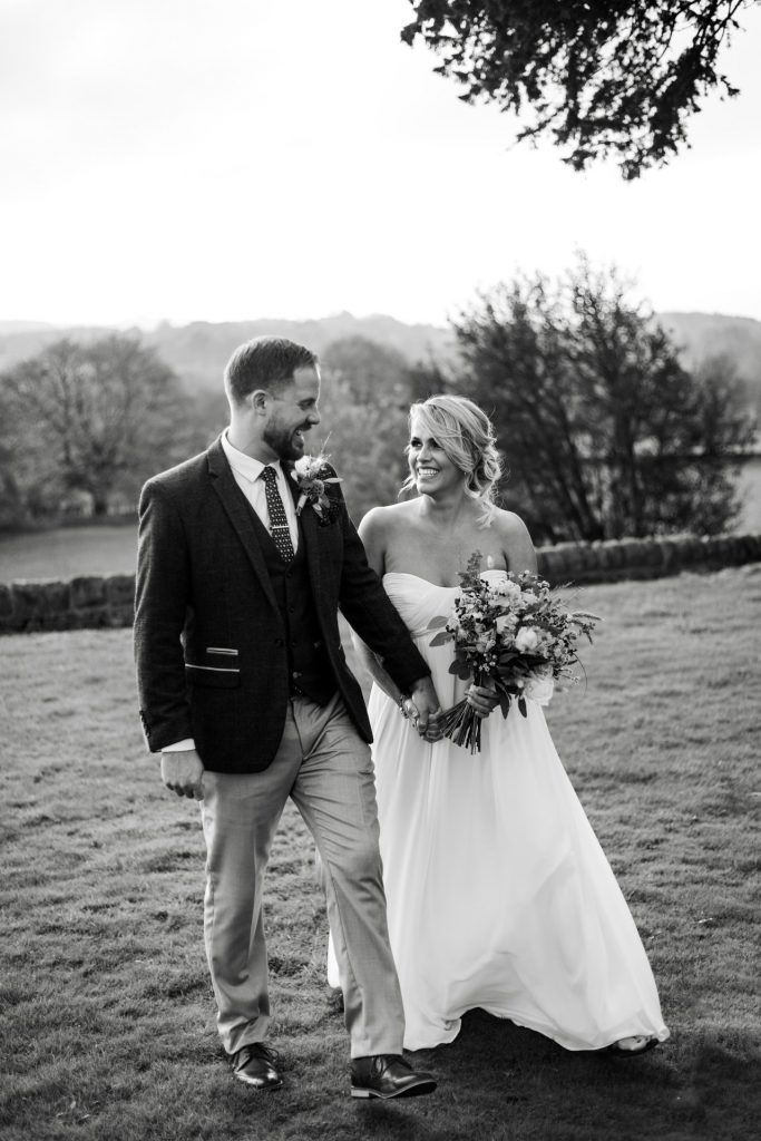 Bride & Groom pose outside of their venue after the wedding ceremony at their micro wedding at The Cavendish Hotel