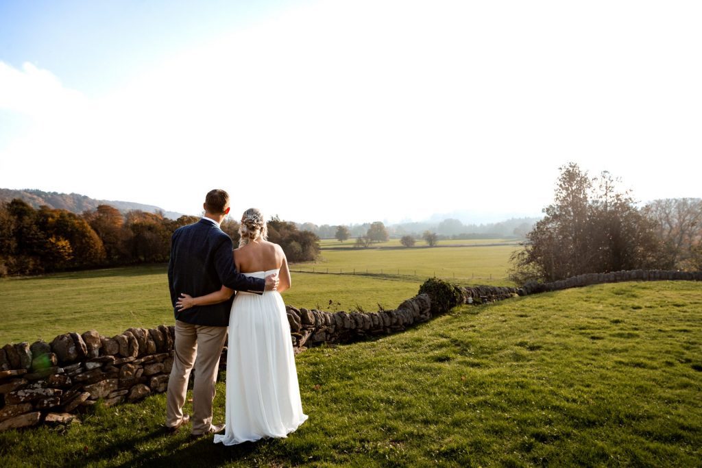 Bride & Groom pose outside of their venue after the wedding ceremony at their micro wedding at The Cavendish Hotel