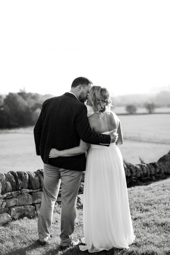 Bride & Groom pose outside of their venue after the wedding ceremony at their micro wedding at The Cavendish Hotel