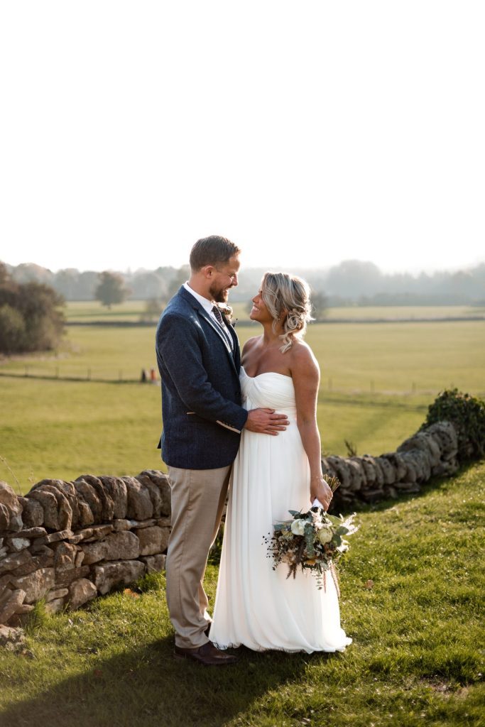 Bride & Groom pose outside of their venue after the wedding ceremony at their micro wedding at The Cavendish Hotel