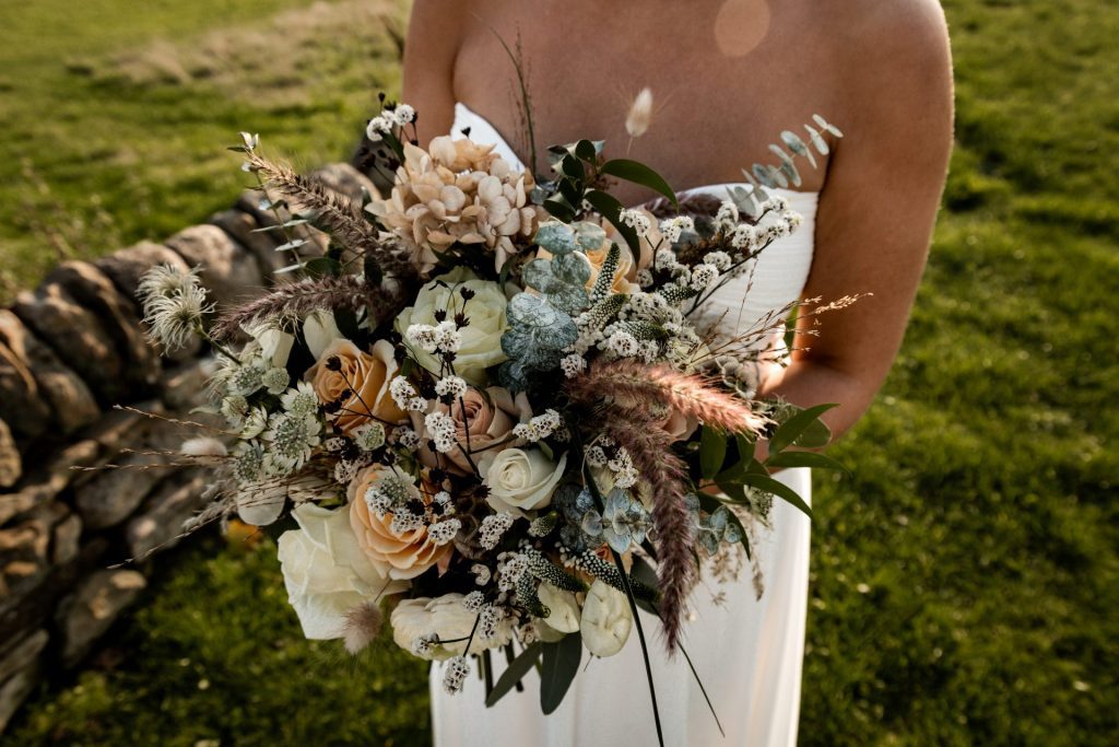 Detail photo of the autumnal wedding flowers at a micro wedding at The Cavendish Hotel