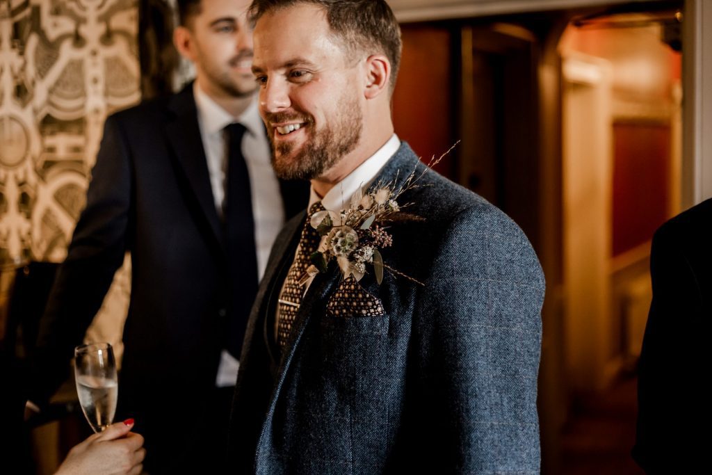 Candid photo of the Groom and their wedding guests at a micro wedding at The Cavendish Hotel