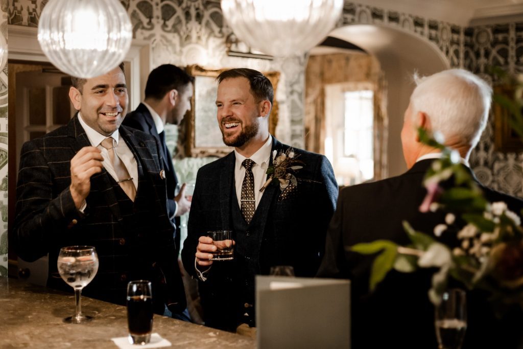 Candid photo of Groom and wedding guests at a micro wedding at The Cavendish Hotel