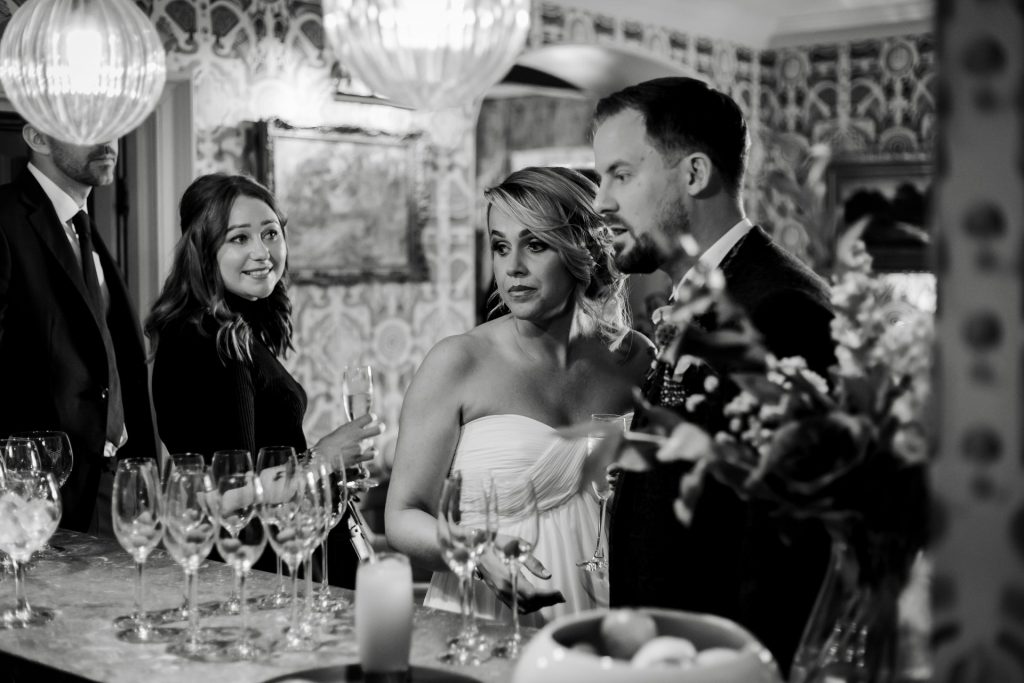 Candid photo of the Bride & Groom and their wedding guests at a micro wedding at The Cavendish Hotel