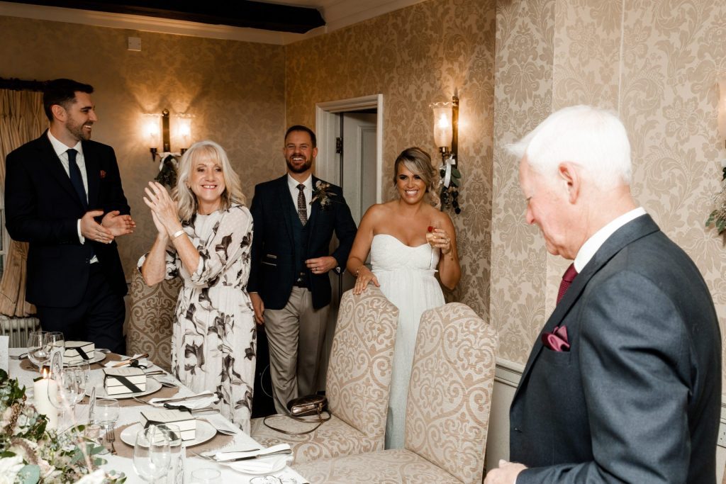 Bride & groom entering the wedding breakfast of their Micro wedding at The Cavendish Hotel