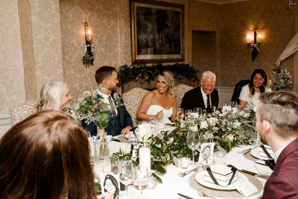 Bride, groom & guests sitting down at the wedding breakfast of their Micro wedding at The Cavendish Hotel
