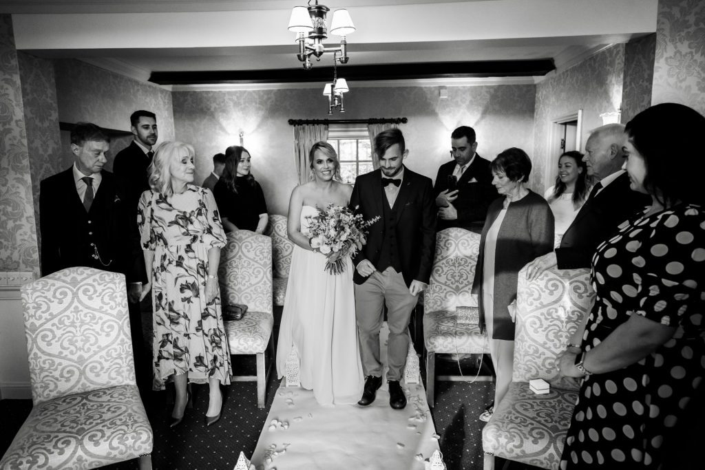 Bride being walked down the aisle at their micro wedding at The Cavendish Hotel