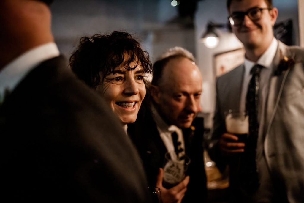 Candid photo of wedding party after the wedding ceremony. Photo in colour