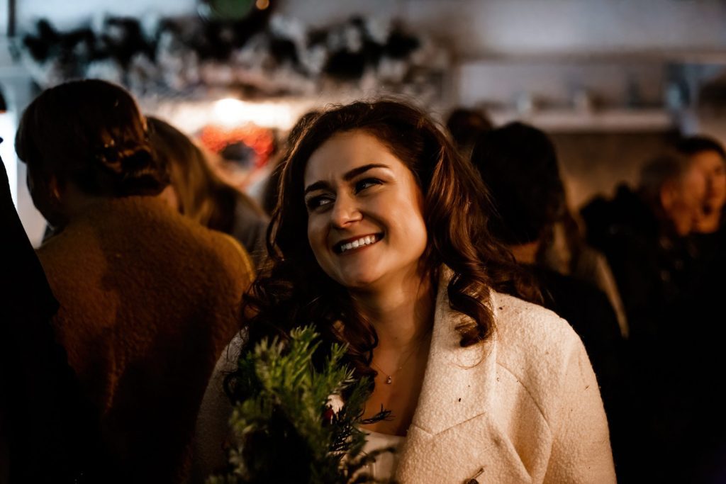 Candid photo of wedding party after the wedding ceremony. Photo in colour