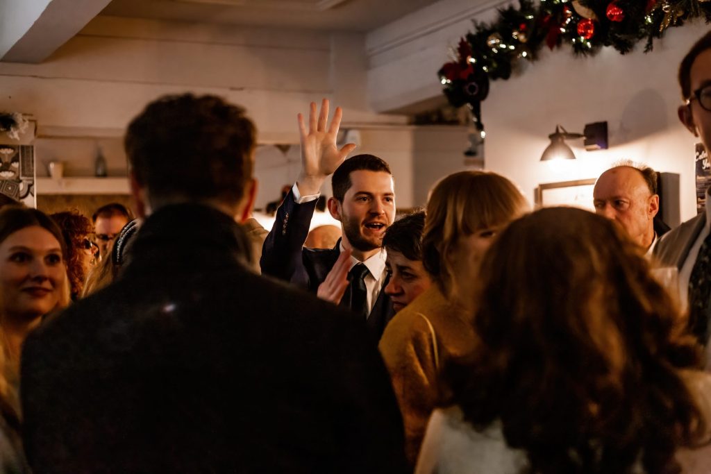 Candid photo of wedding party after the wedding ceremony. Photo in colour