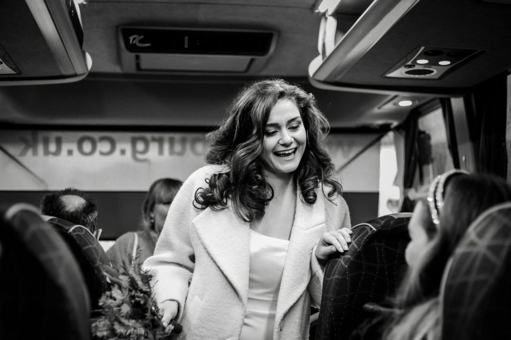 Candid photo of wedding party after the wedding ceremony. Photo in black & white