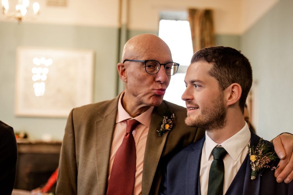 Candid photo of wedding party after the wedding ceremony. Photo in colour