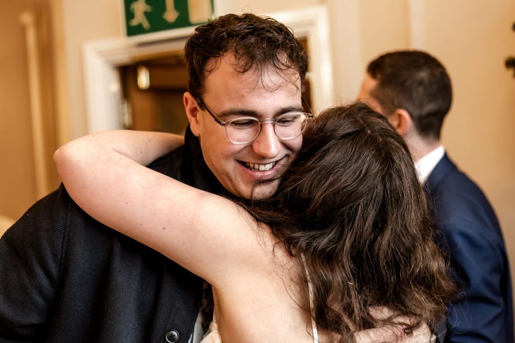 Candid photo during the wedding breakfast at the Monsall Head Pub. Photo in colour.