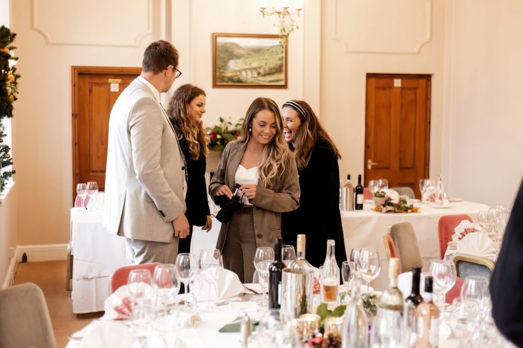 Candid photo during the wedding breakfast at the Monsall Head Pub. Photo in colour.