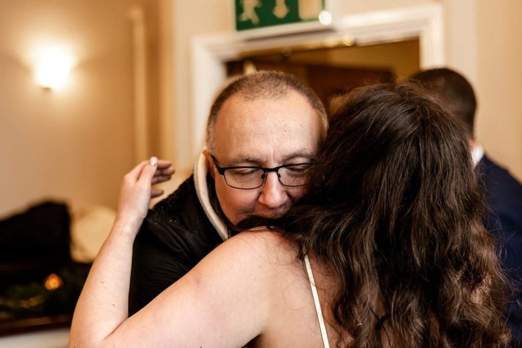 Candid photo during the wedding breakfast at the Monsall Head Pub. Photo in colour.