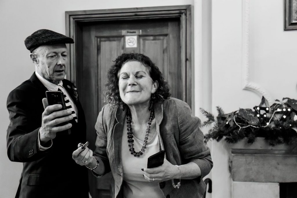 Candid photo during the wedding breakfast at the Monsall Head Pub. Photo in black & white.