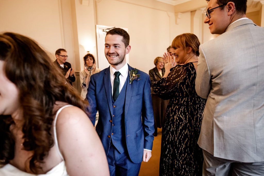 Candid photo annoucing the Bride & Groom to the Wedding Breakfast at the Monsall Head Pub. Photo in colour.