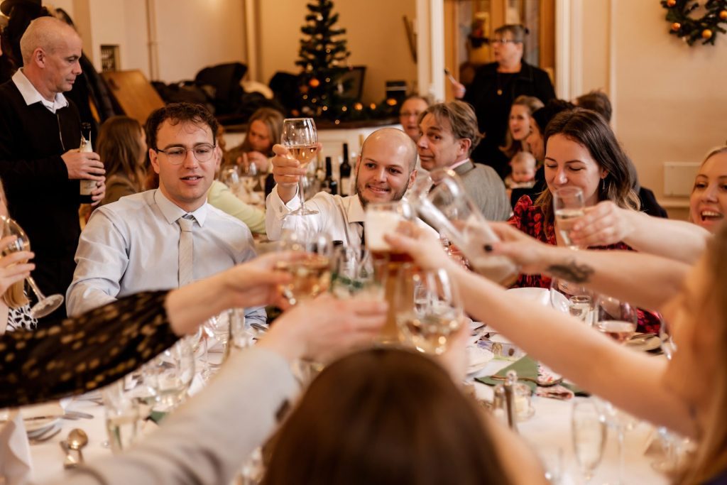 Candid photo during the wedding speeches at the Monsall Head Pub. Photo in colour.