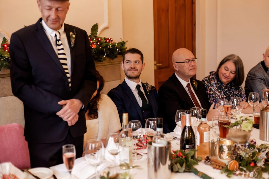 Candid photo during the wedding speeches at the Monsall Head Pub. Photo in colour.