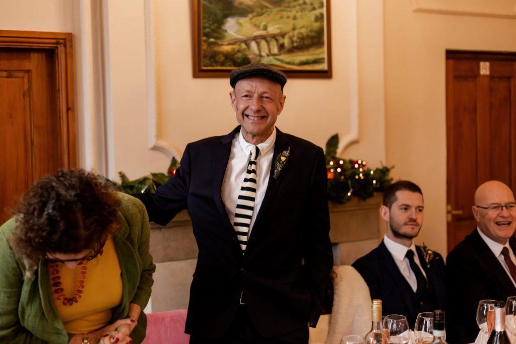 Candid photo during the wedding speeches at the Monsall Head Pub. Photo in colour.