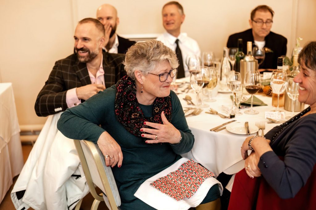 Candid photo during the wedding speeches at the Monsall Head Pub. Photo in colour.