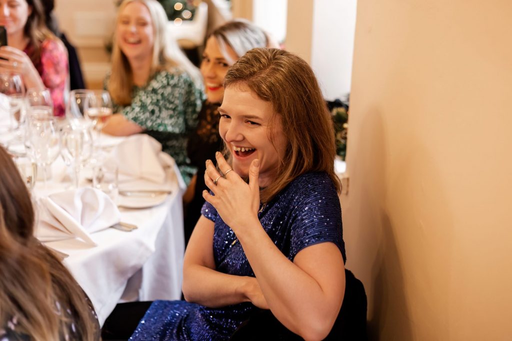 Candid photo during the wedding speeches at the Monsall Head Pub. Photo in colour.