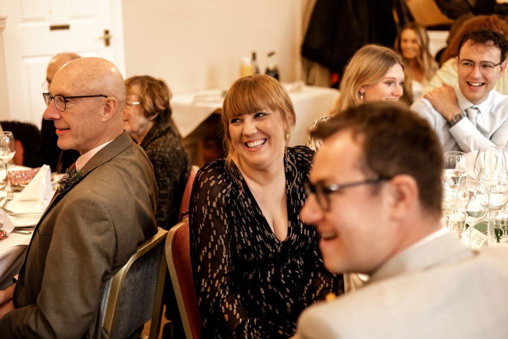Candid photo during the wedding speeches at the Monsall Head Pub. Photo in colour.