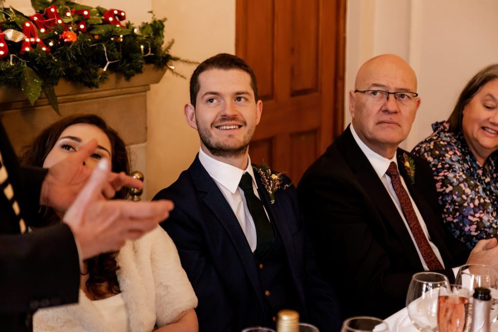 Candid photo during the wedding speeches at the Monsall Head Pub. Photo in colour.