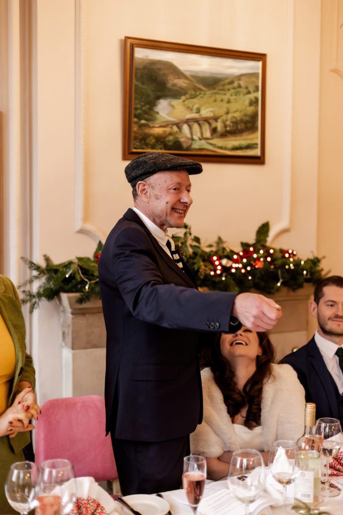 Candid photo during the wedding speeches at the Monsall Head Pub. Photo in colour.