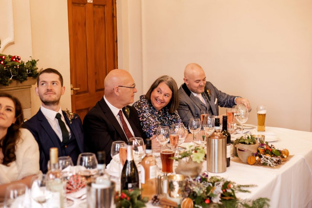Candid photo during the wedding speeches at the Monsall Head Pub. Photo in colour.