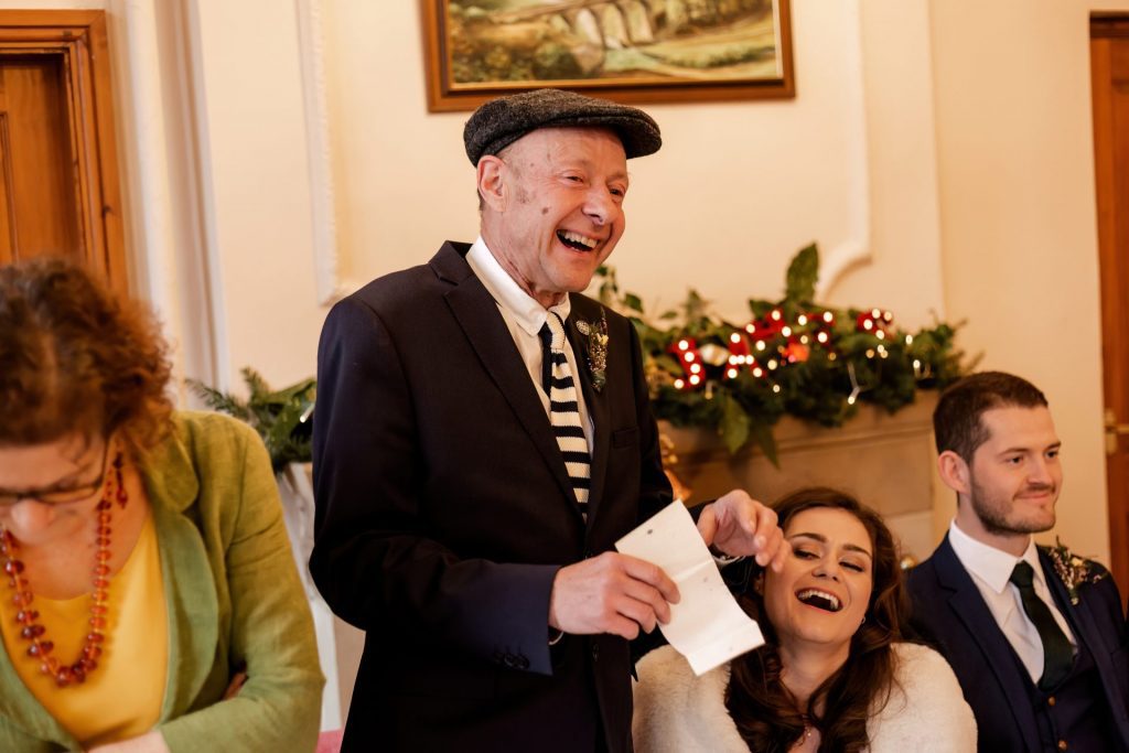 Candid photo during the wedding speeches at the Monsall Head Pub. Photo in colour.
