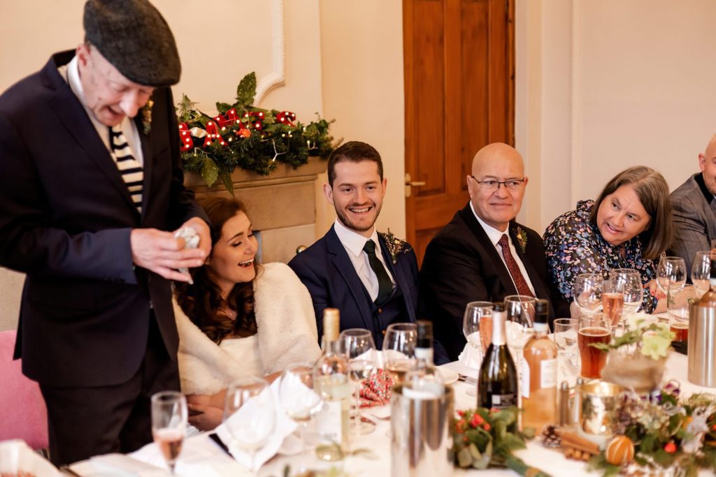 Candid photo during the wedding speeches at the Monsall Head Pub. Photo in colour.