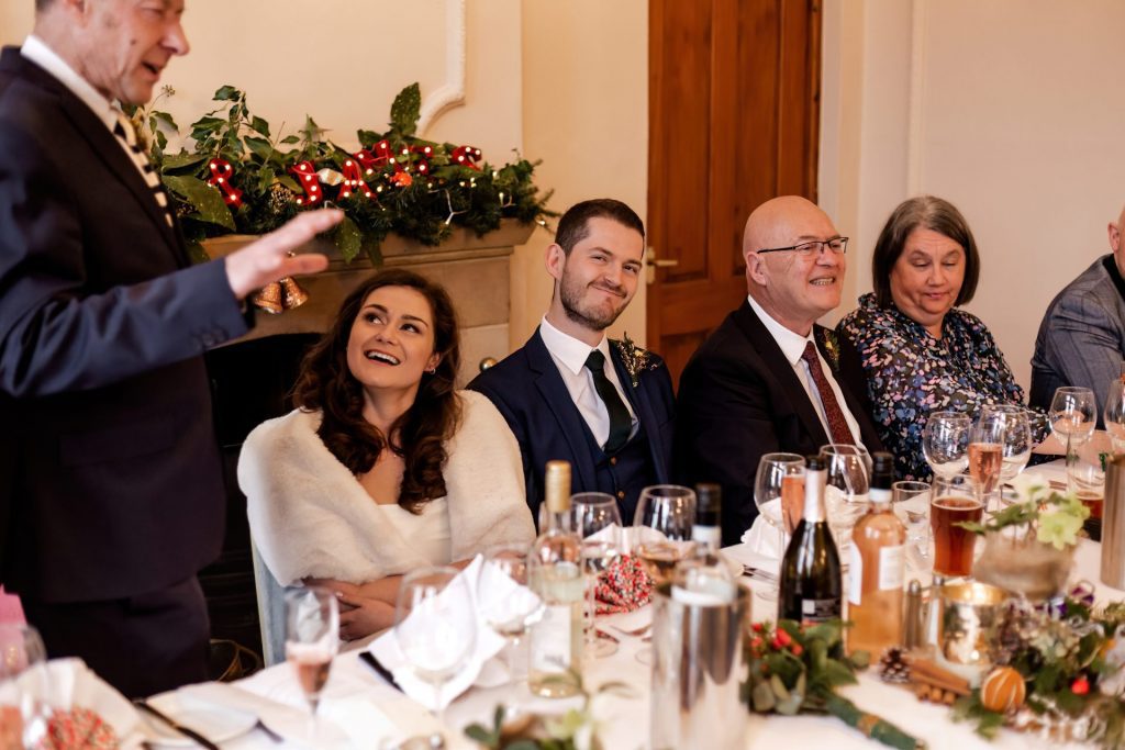 Candid photo during the wedding speeches at the Monsall Head Pub. Photo in colour.